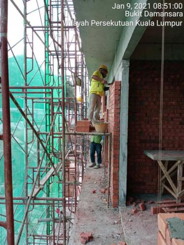 Block B - brickworks in progress with safety netting. 