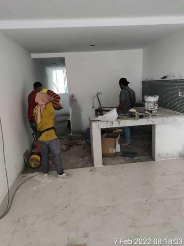 Block B - kitchen tiling in progress. 