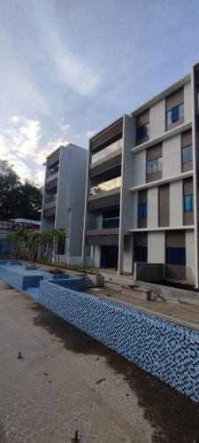 Overall view of Block A and swimming pool in foreground. 
