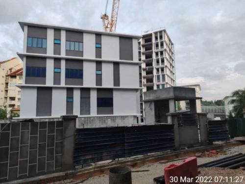 Block A - side view , external painting completed. External perimeter wall and guard house works in progress. 