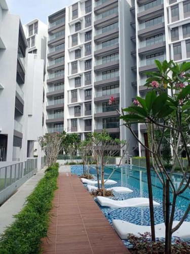 Swimming pool deck with sun loungers installed. 