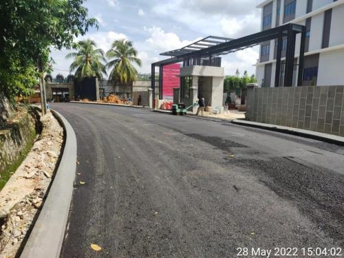 Front view of main entrance and guardhouse with roadworks completed.