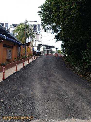Front view of main entrance and guardhouse with roadworks completed.