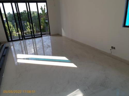 Block B - living room with tiles and sliding doors installed.