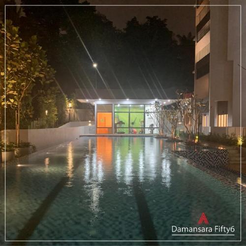 Night view of pool and gym.